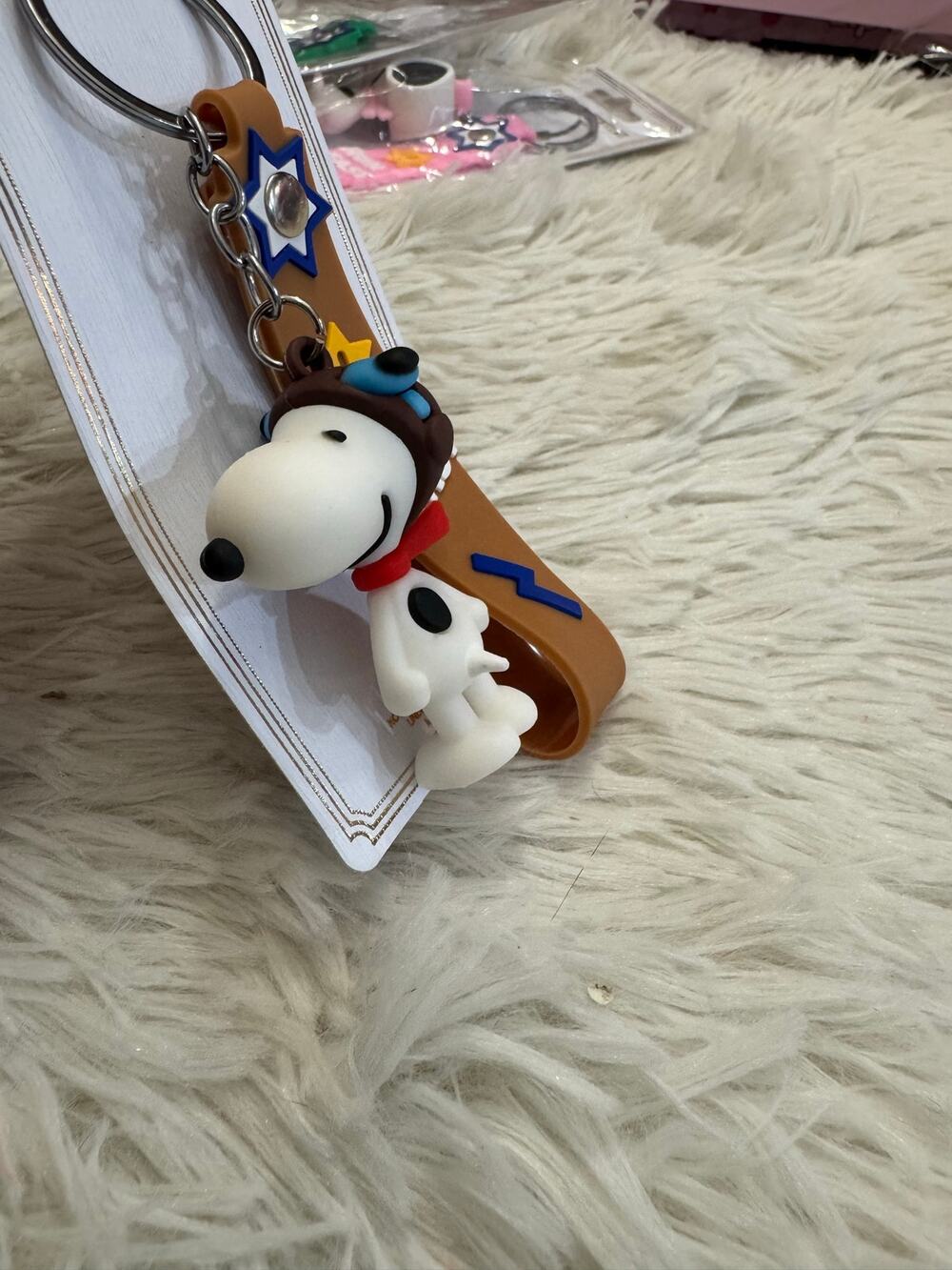 Snoopy aviator rubber keychain with brown strap